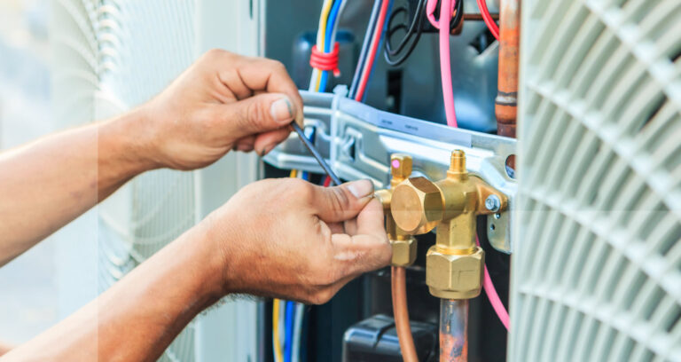 Technician performing maintenance on a co2 refrigeration system