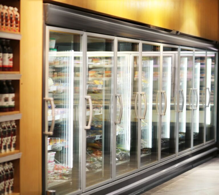 Long Refrigerated Display Cases filled with Products for a Retail Space,